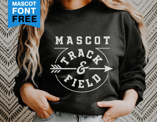 Person wearing a black sweatshirt featuring a 'Mascot Track & Field' design with an arrow and decorative font.