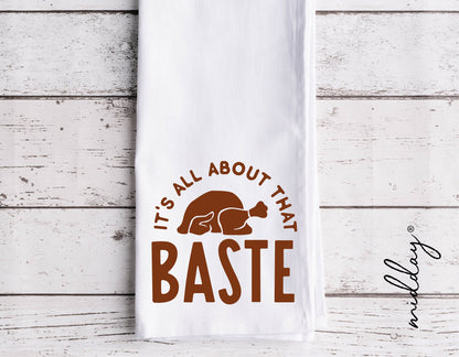 "It's All About That Baste" turkey design on a white kitchen towel for Thanksgiving decor.