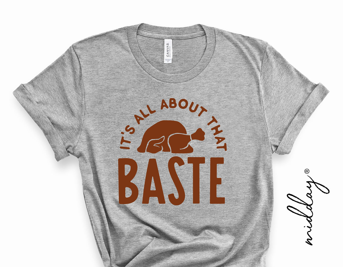 Gray t-shirt with 'It's All About That Baste' turkey design, perfect for Thanksgiving or fall crafting projects.