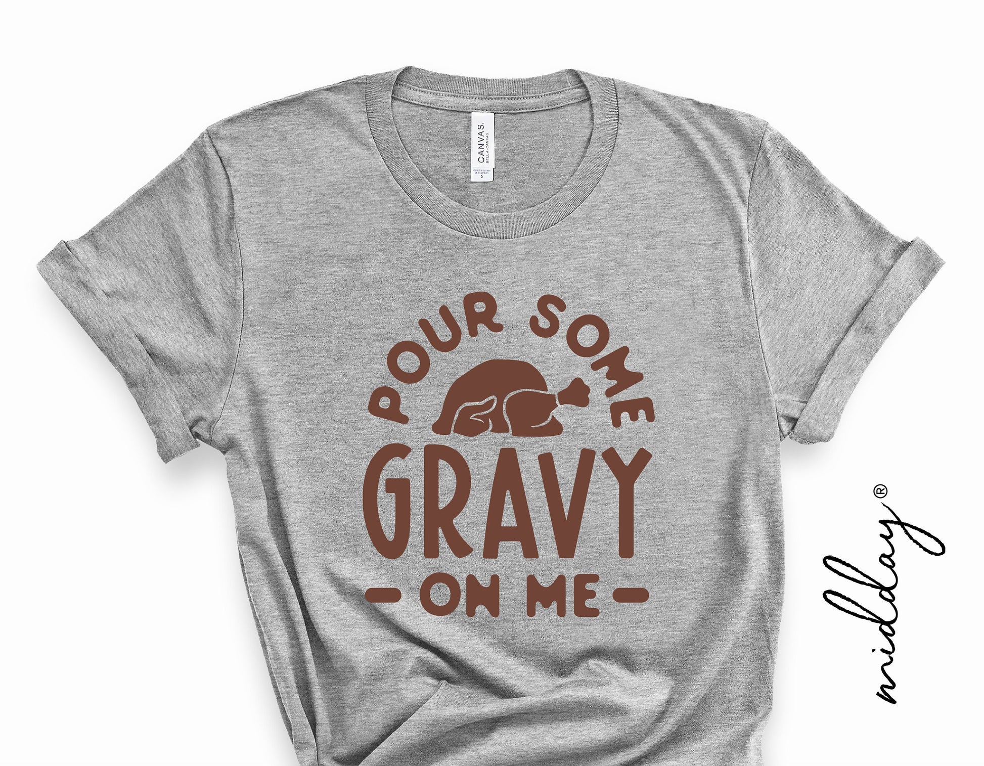 Gray t-shirt with 'Pour Some Gravy On Me' and turkey graphic, perfect for funny Thanksgiving and fall-themed cricut projects.