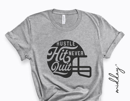 Gray t-shirt with "Hustle Hit Never Quit" football helmet graphic, perfect for football moms and players. Ideal for Cricut and Silhouette.