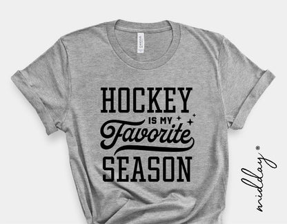 Gray t-shirt with 'Hockey Is My Favorite Season' graphic design, perfect for hockey enthusiasts and players.
