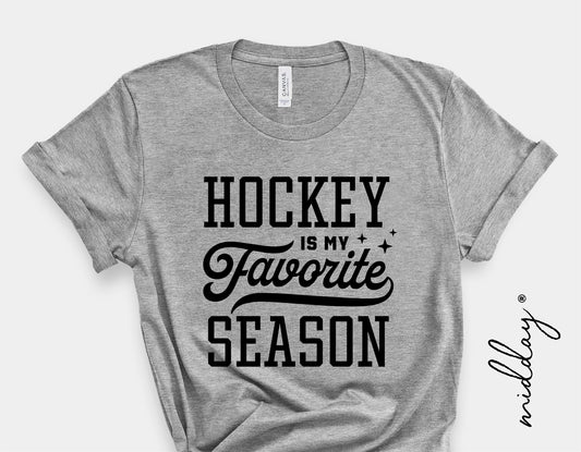 Gray t-shirt with 'Hockey Is My Favorite Season' graphic design, perfect for hockey enthusiasts and players.