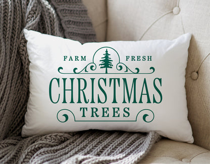 Farm Fresh Christmas Trees decorative pillow on a beige couch with gray knit throw blanket, holiday decor inspiration.