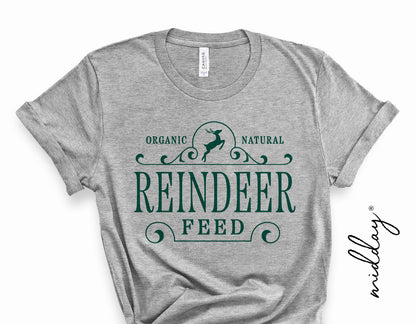 Gray t-shirt with green 'Reindeer Feed' design, featuring a small silhouette of a reindeer, ideal for holiday Cricut and Silhouette projects.