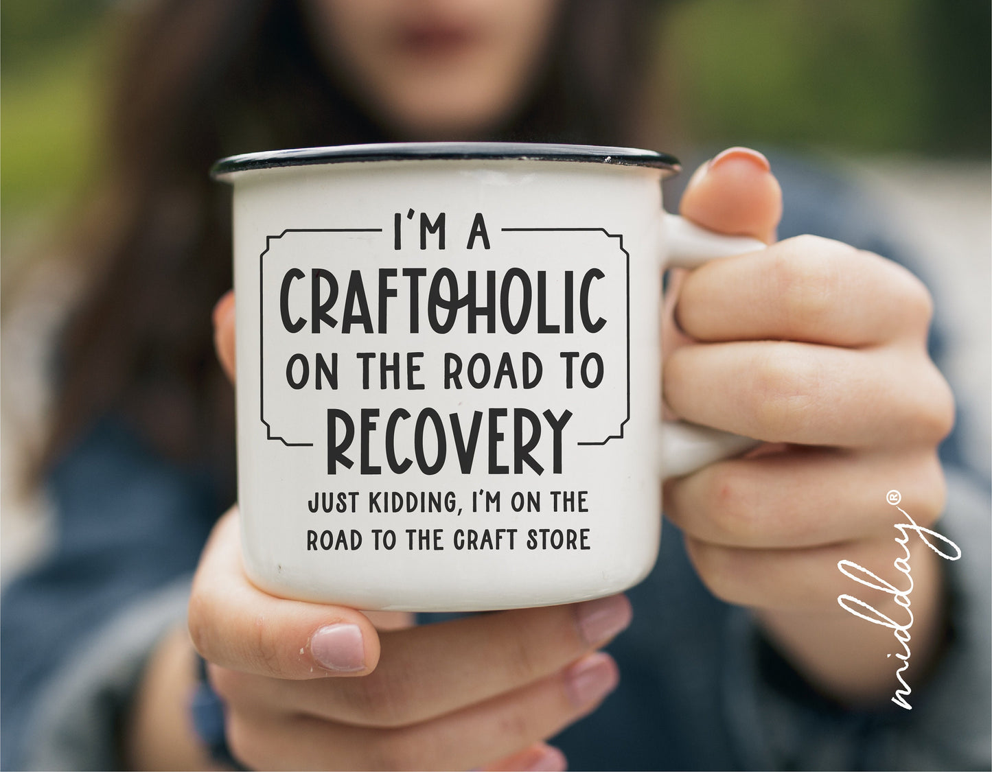 Woman holding a mug with text 'I'm a Craftoholic on the Road to Recovery, Just Kidding, I'm on the Road to the Craft Store'