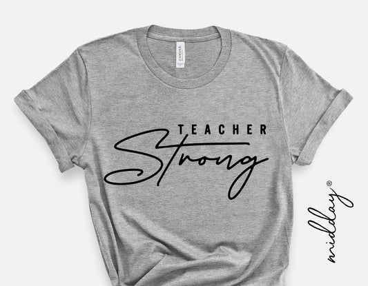 Grey t-shirt with 'Teacher Strong' in black script, perfect for teacher appreciation gifts, available in SVG and DXF formats for DIY projects.