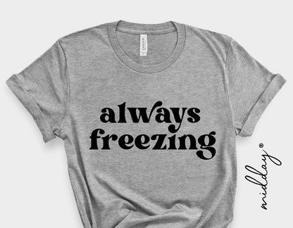 Gray t-shirt with 'always freezing' text, perfect for winter and holiday humor, ideal for Cricut and sublimation projects.