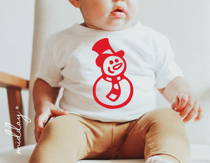 Baby wearing a white shirt with red snowman SVG design, perfect for Cricut and Silhouette holiday projects and decorations.