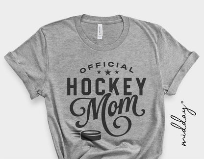 Gray t-shirt with 'Official Hockey Mom' design featuring stars and a hockey puck graphic.