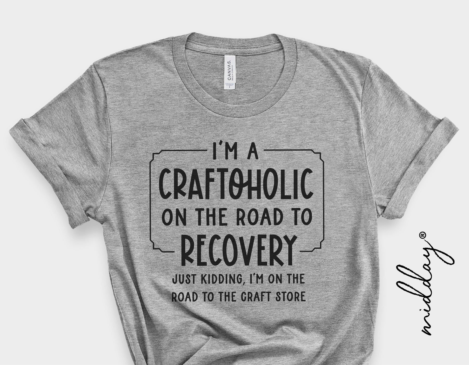 Gray t-shirt with 'I'm a Craftoholic on the road to recovery, just kidding, I'm on the road to the craft store' text design.