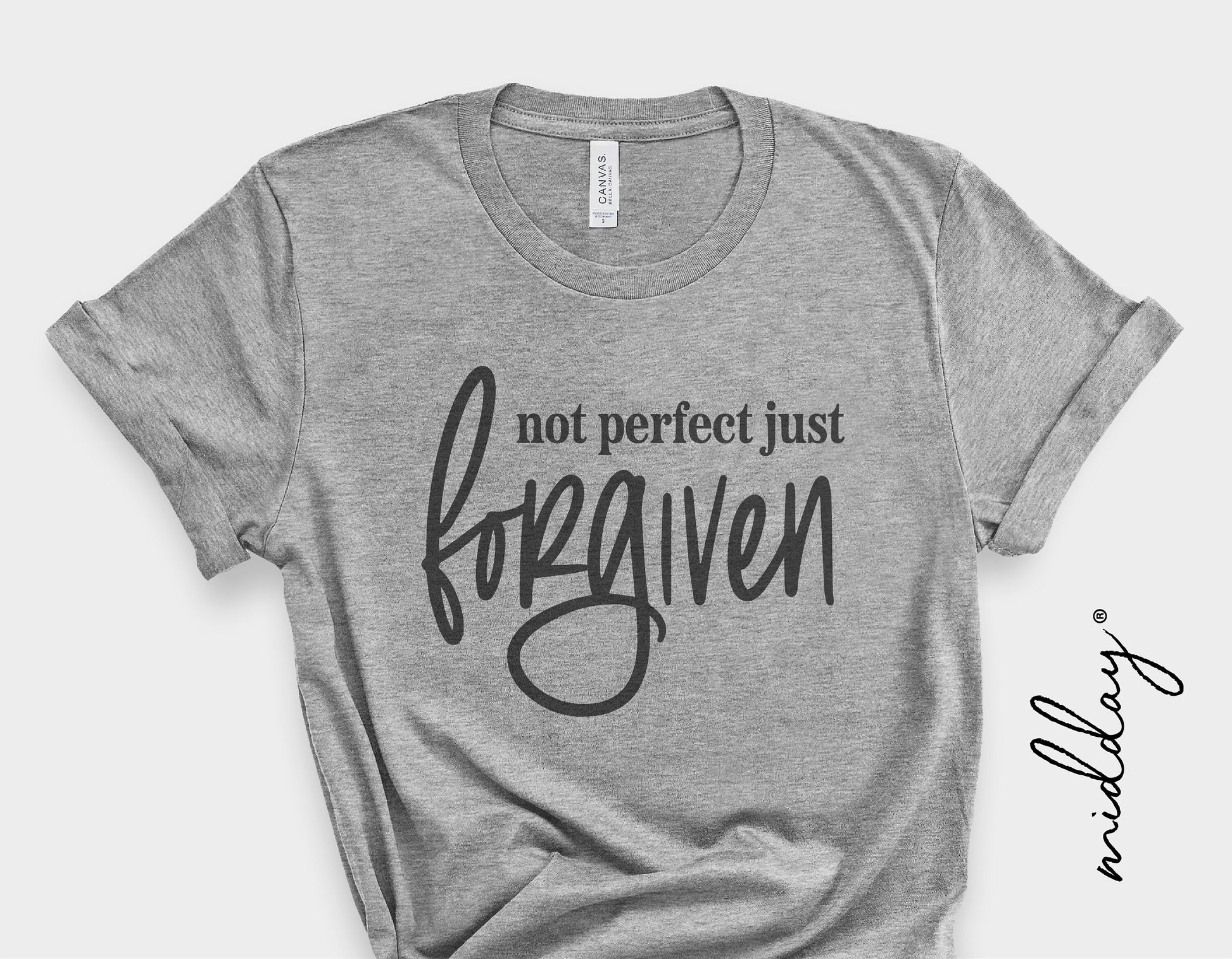 Gray T-shirt with 'Not Perfect Just Forgiven' text design, ideal for Christian SVG projects, Cricut crafts, and faith-based apparel.