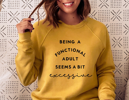 Woman wearing a yellow sweatshirt with 'Being a functional adult seems a bit excessive' text. Sarcastic design for new parents.