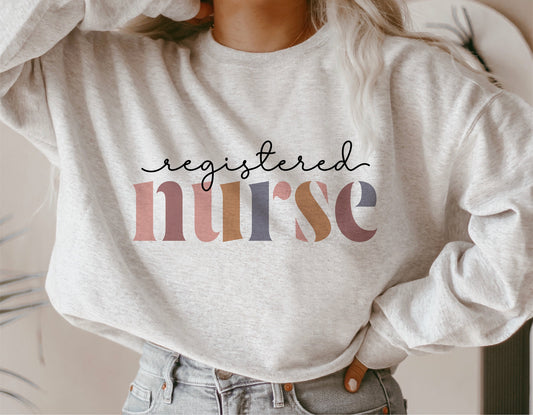Cozy sweatshirt with 'Registered Nurse' text in colorful letters, ideal for nurse appreciation gifts or casual wear.