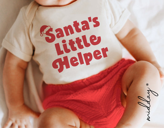 Baby wearing 'Santa's Little Helper' Christmas shirt, perfect for kids holiday decor and Cricut craft projects.