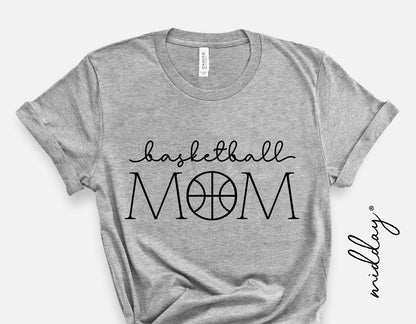 Gray t-shirt with 'Basketball Mom' design featuring basketball-themed lettering, ideal for sports moms or basketball fans.