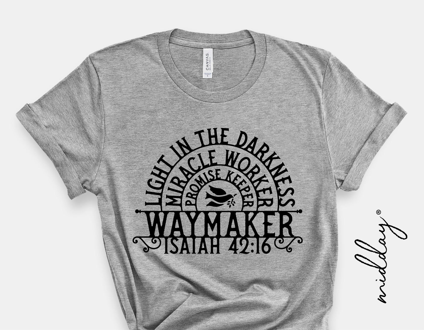 Gray T-shirt featuring "Waymaker, Light in the Darkness, Miracle Worker, Isaiah 42:16" design for Silhouette and Cricut projects.