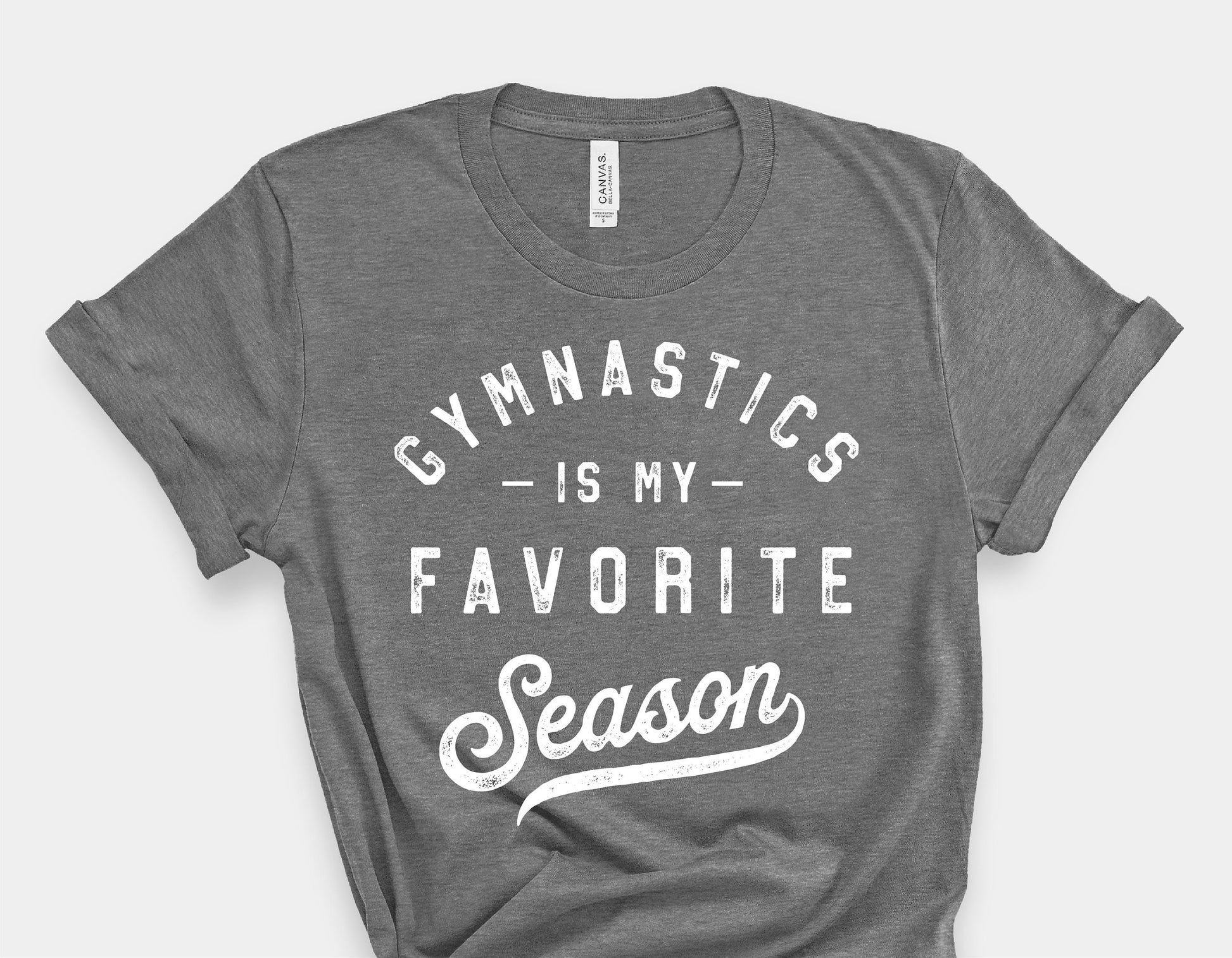 Gray t-shirt with 'Gymnastics is My Favorite Season' text, designed for gymnastics moms, compatible with Cricut and Silhouette.