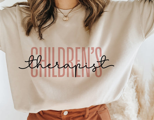 Children's Therapist text design on a beige sweatshirt for Cricut projects and sublimation.