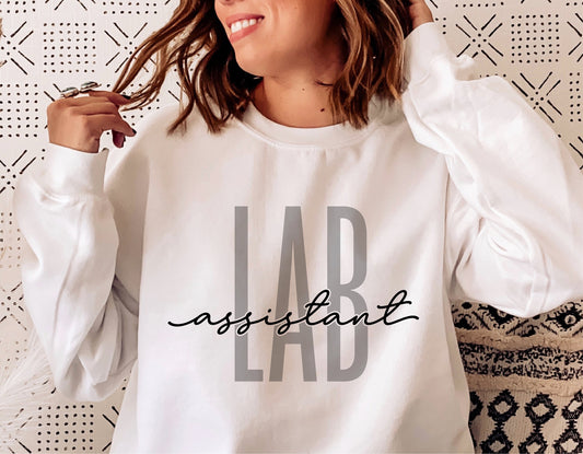 Woman wearing white sweatshirt with 'Lab Assistant' text in stylish font, suitable for Cricut and sublimation projects.