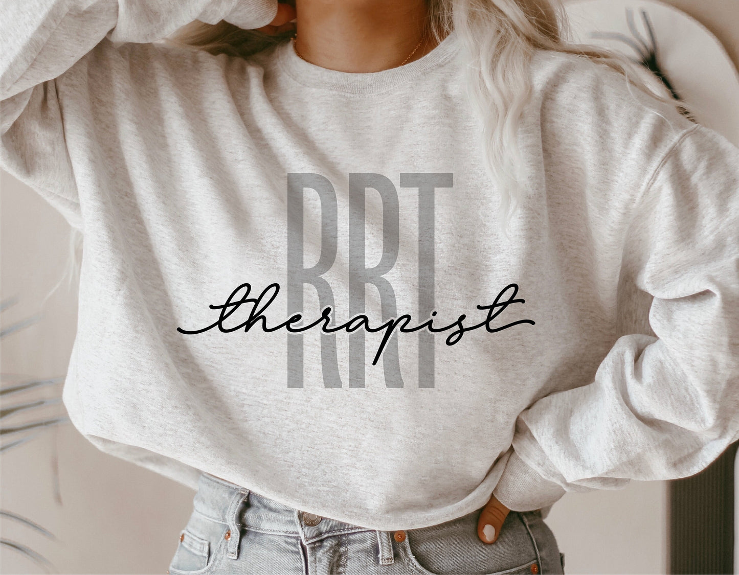 Sweatshirt featuring 'RRT Therapist' design, perfect for registered respiratory therapist gifts. Ideal for Cricut and Silhouette crafting.