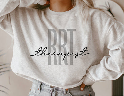 Sweatshirt featuring 'RRT Therapist' design, perfect for registered respiratory therapist gifts. Ideal for Cricut and Silhouette crafting.