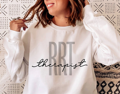 Woman wearing a white sweatshirt with 'RRT Therapist' design, ideal for registered respiratory therapist merchandise, digital cut file.