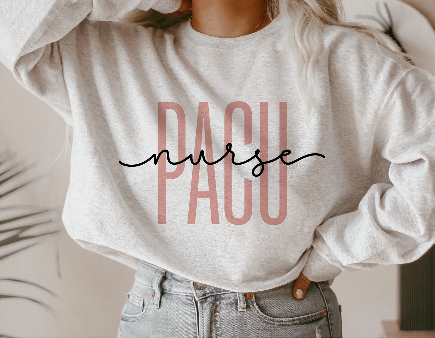 Woman wearing a PACU Nurse shirt, featuring stylish lettering design, ideal for Cricut and Silhouette cutting projects.