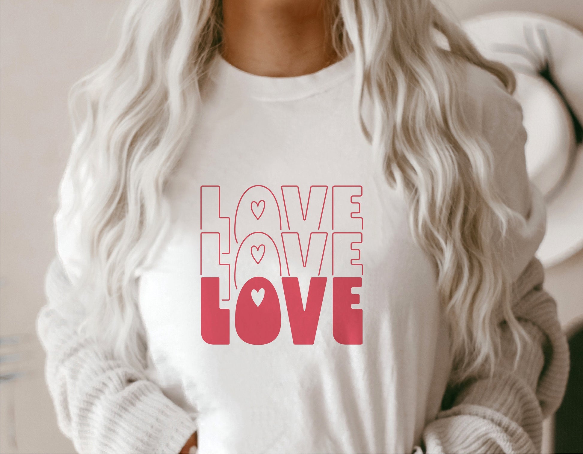 White t-shirt with pink 'Love Love Love' design, perfect for Valentine's Day or teacher gifts. Ideal for Cricut and Silhouette projects.