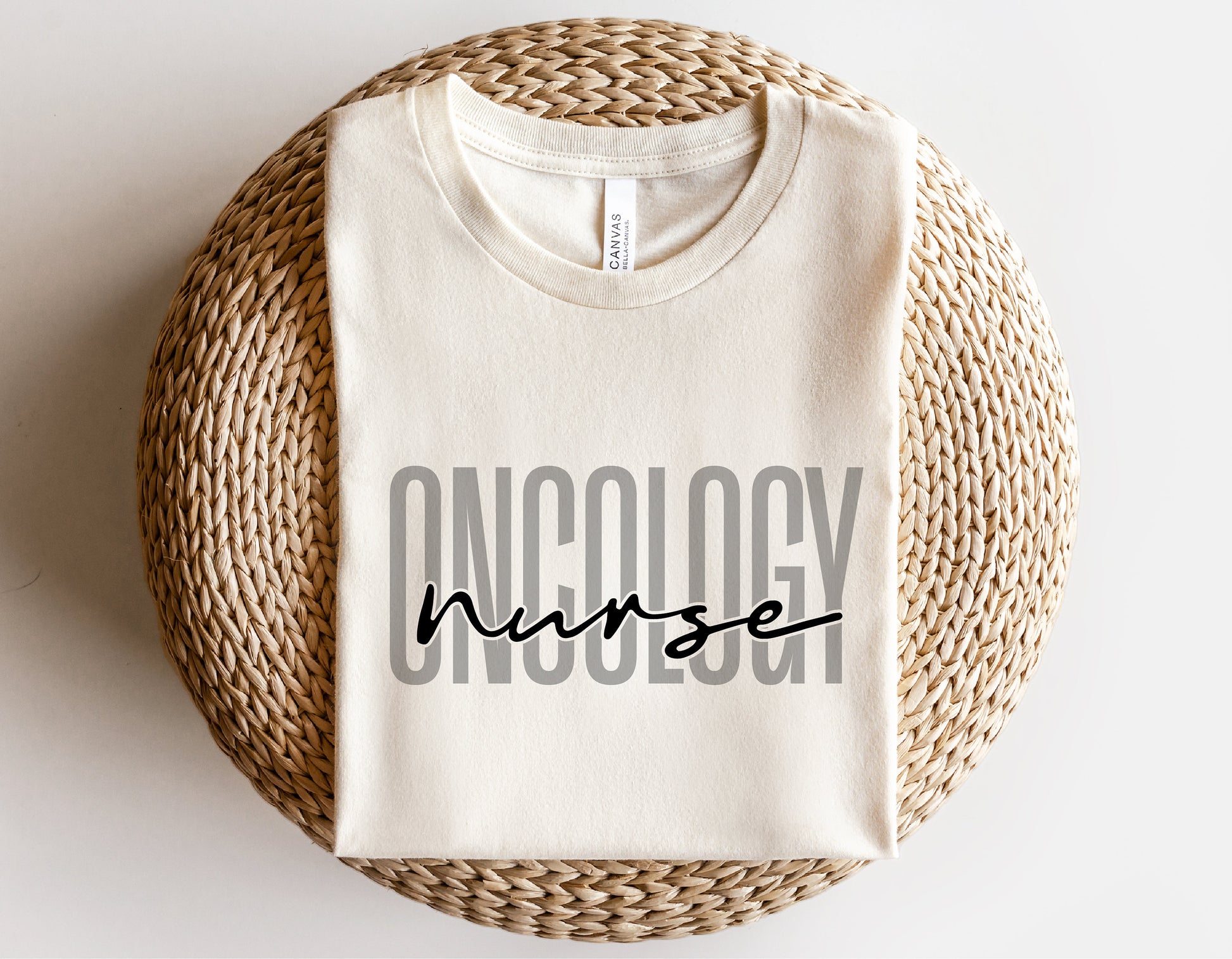 White folded shirt with 'Oncology Nurse' text design for digital download. Perfect for Cricut and Silhouette projects.