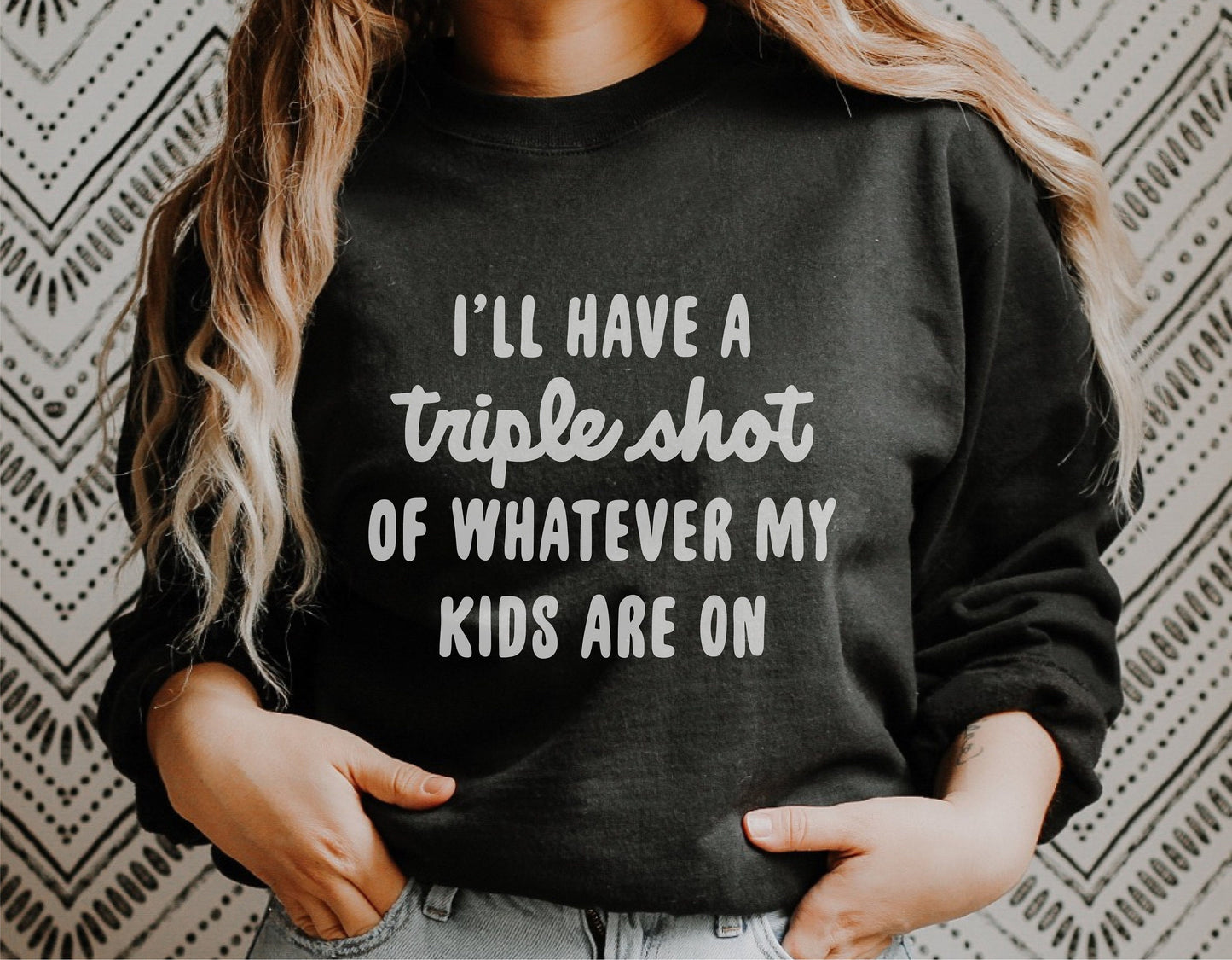 Funny mom shirt with 'I'll have a triple shot of whatever my kids are on' text, perfect for Cricut and Silhouette projects.