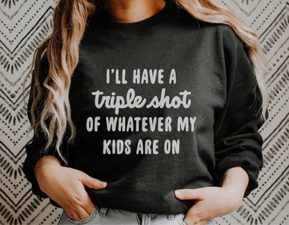Funny mom shirt with 'I'll have a triple shot of whatever my kids are on' text, perfect for Cricut and Silhouette projects.