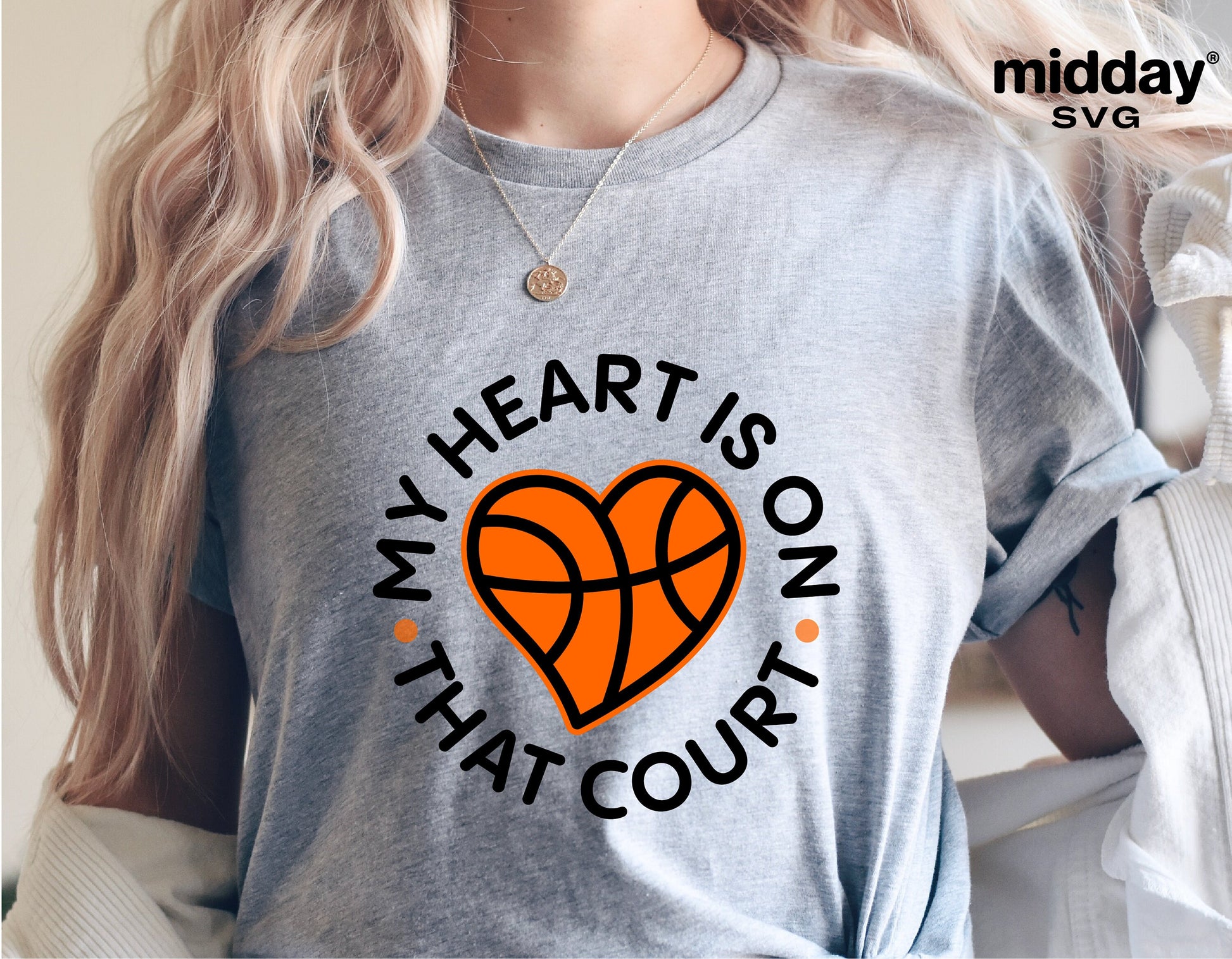 Woman wearing a grey t-shirt with 'My Heart is on That Court' basketball design for SVG files, perfect for Cricut and Silhouette projects.