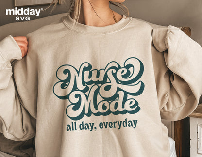 Sweatshirt featuring 'Nurse Mode All Day, Everyday' design for medical professionals, ideal for Cricut and Silhouette projects.