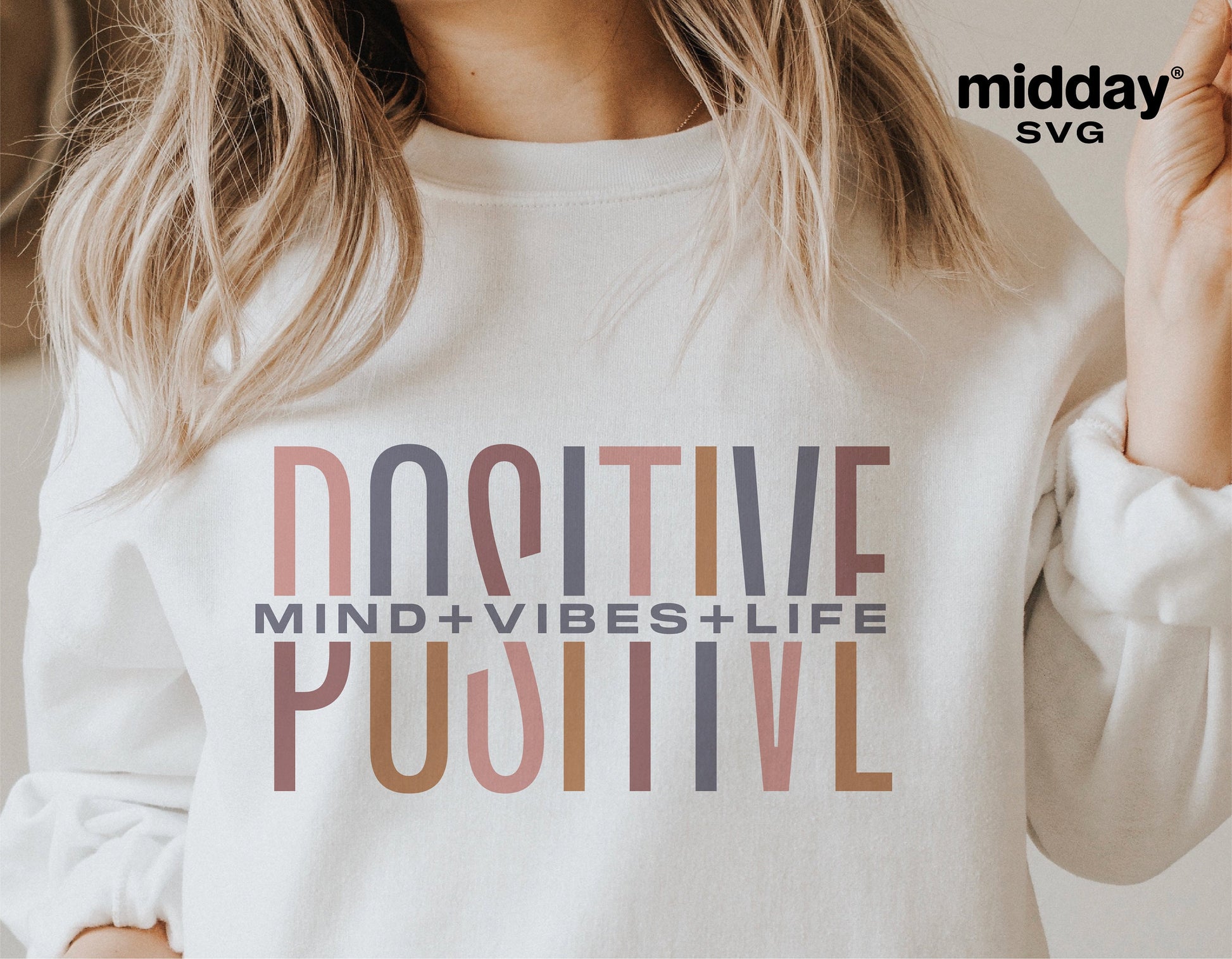 Woman wearing a sweatshirt with 'Positive Mind Vibes Life' design, showcasing motivational and self-love SVG graphics.