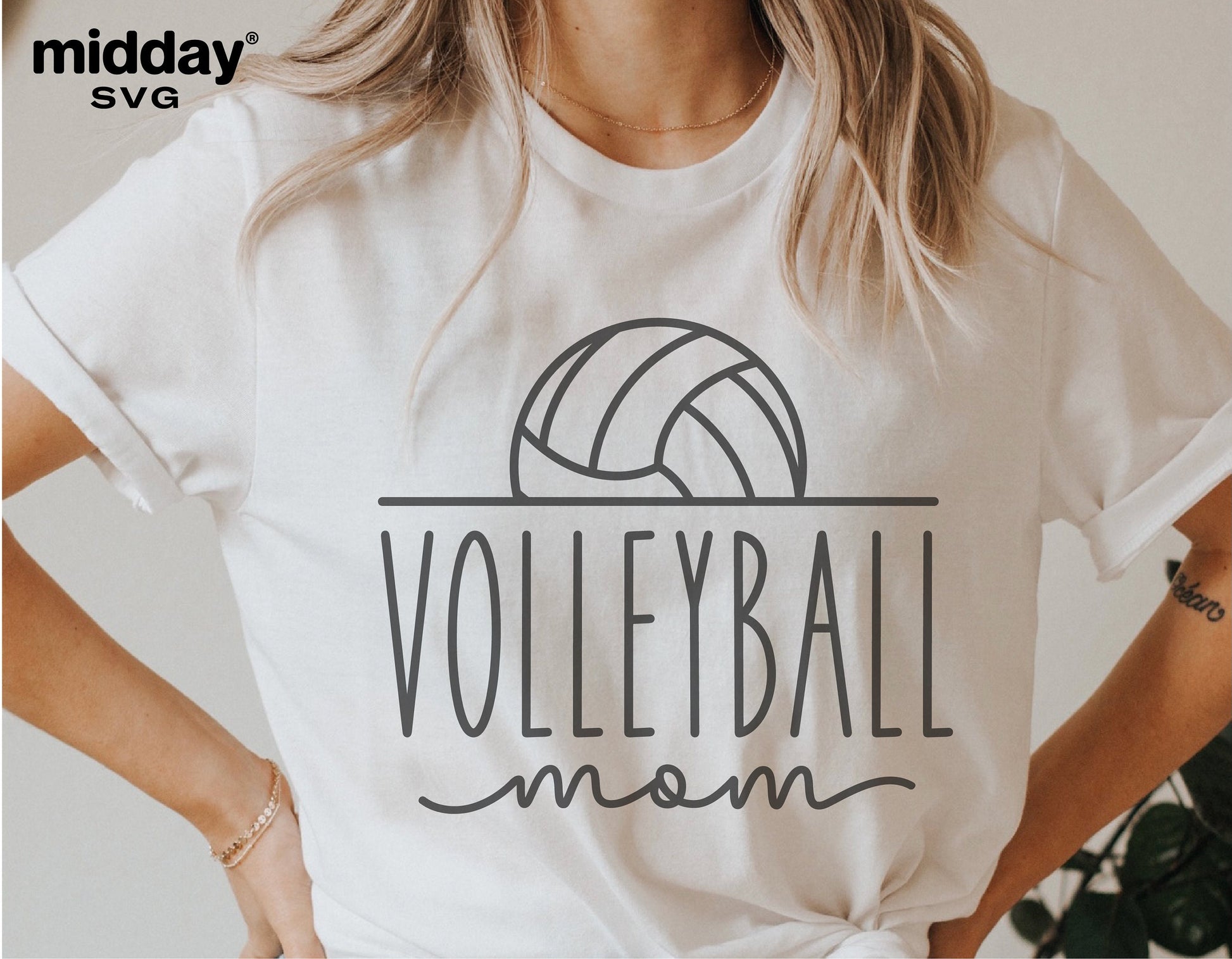 Woman wearing white t-shirt with 'Volleyball Mom' design for Cricut and Silhouette projects.