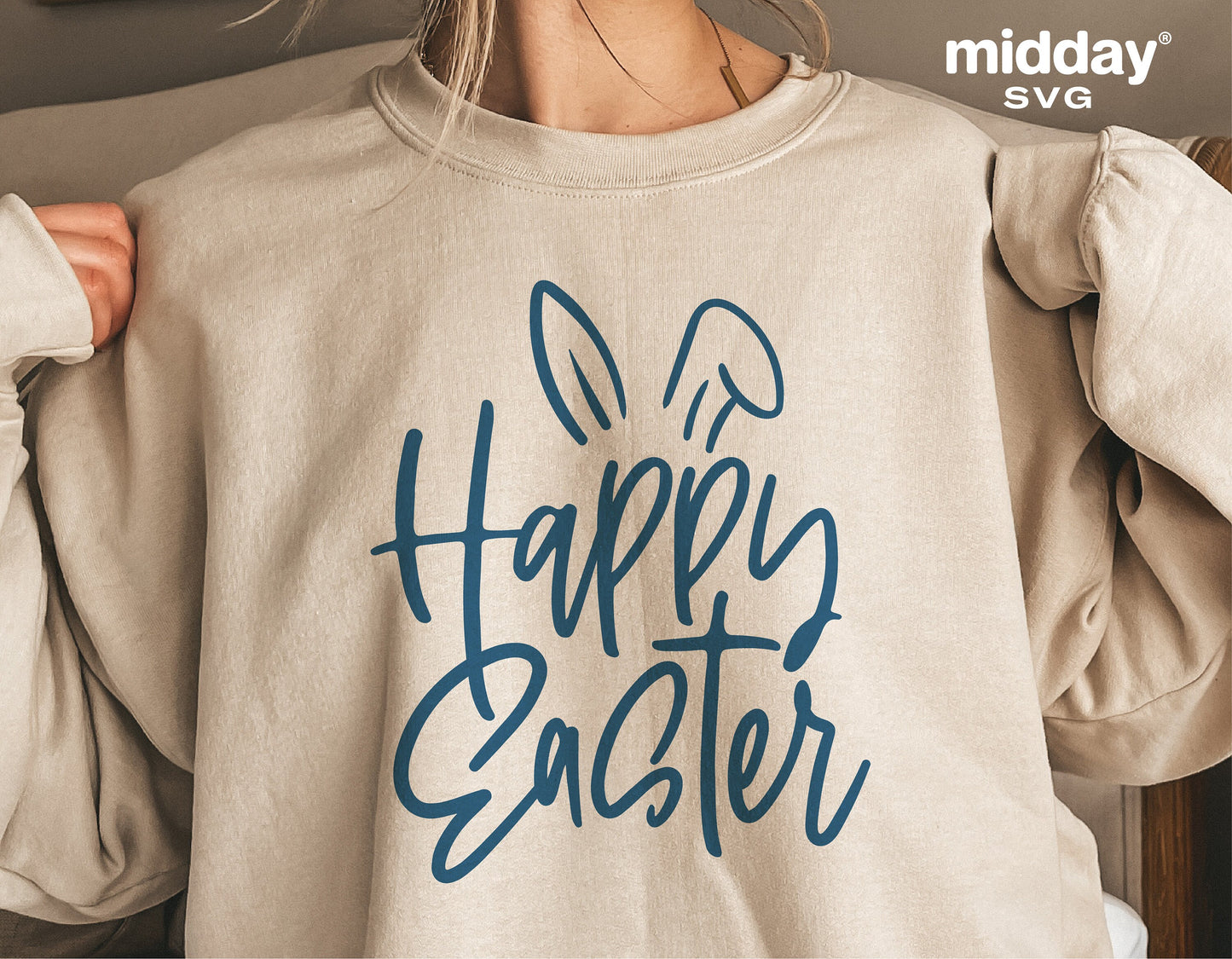 Woman wearing Easter shirt with 'Happy Easter' and bunny ears design in blue, perfect for Cricut and Silhouette projects.