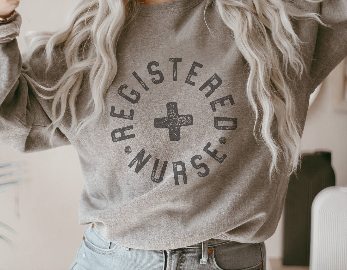 Gray sweatshirt with 'Registered Nurse' text and cross design, perfect for male nurses and healthcare professionals, ideal for Cricut projects.