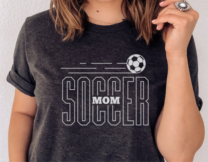 Woman wearing a gray t-shirt with 'Soccer Mom' graphic and soccer ball illustration, perfect for Cricut and Silhouette projects.