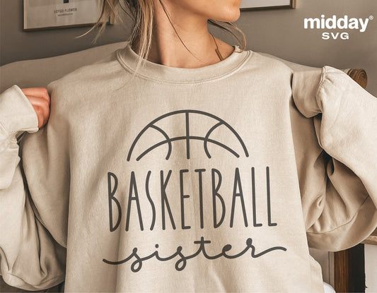 Woman wearing a beige sweatshirt with 'Basketball Sister' SVG design, perfect for Cricut and Silhouette projects, digital download.