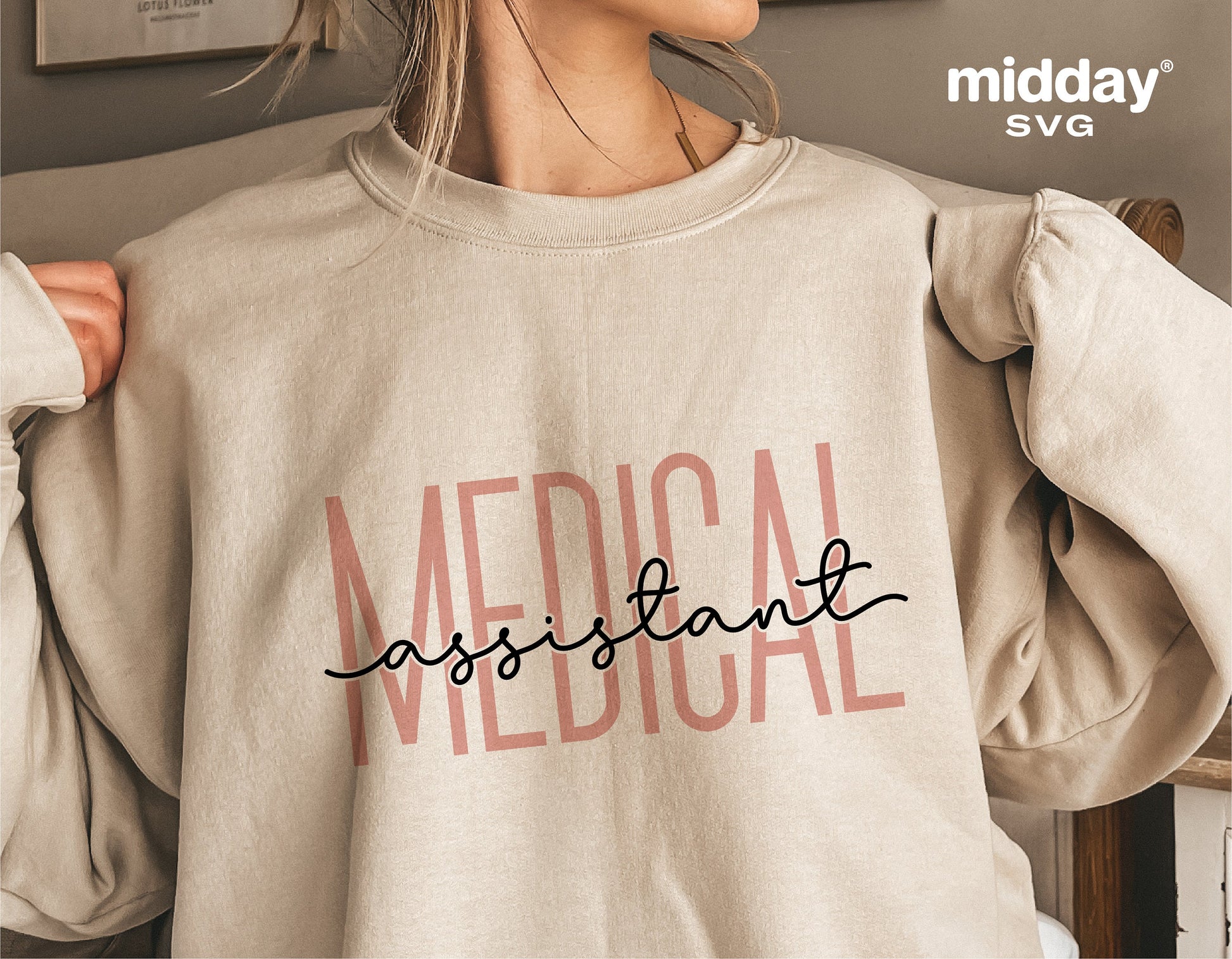 Woman wearing a beige sweatshirt with 'Medical Assistant' text design, suitable for Cricut and Silhouette crafting projects.