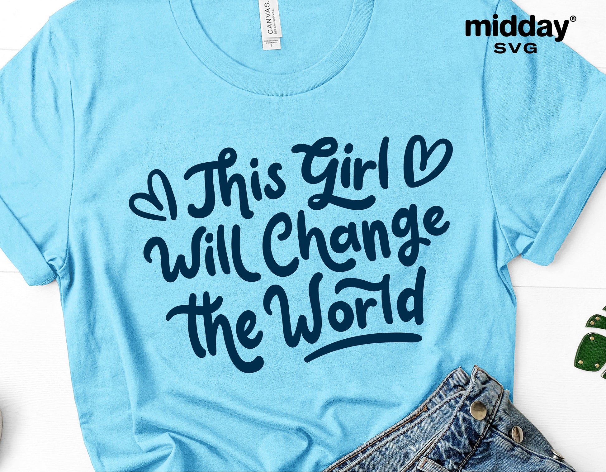 Blue t-shirt with 'This Girl Will Change the World' text design, suitable for SVG, Cricut, and Silhouette projects.