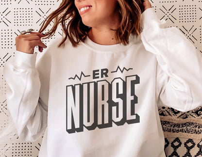 Woman wearing a white sweatshirt with 'ER Nurse' text design, perfect for Cricut and Silhouette projects.