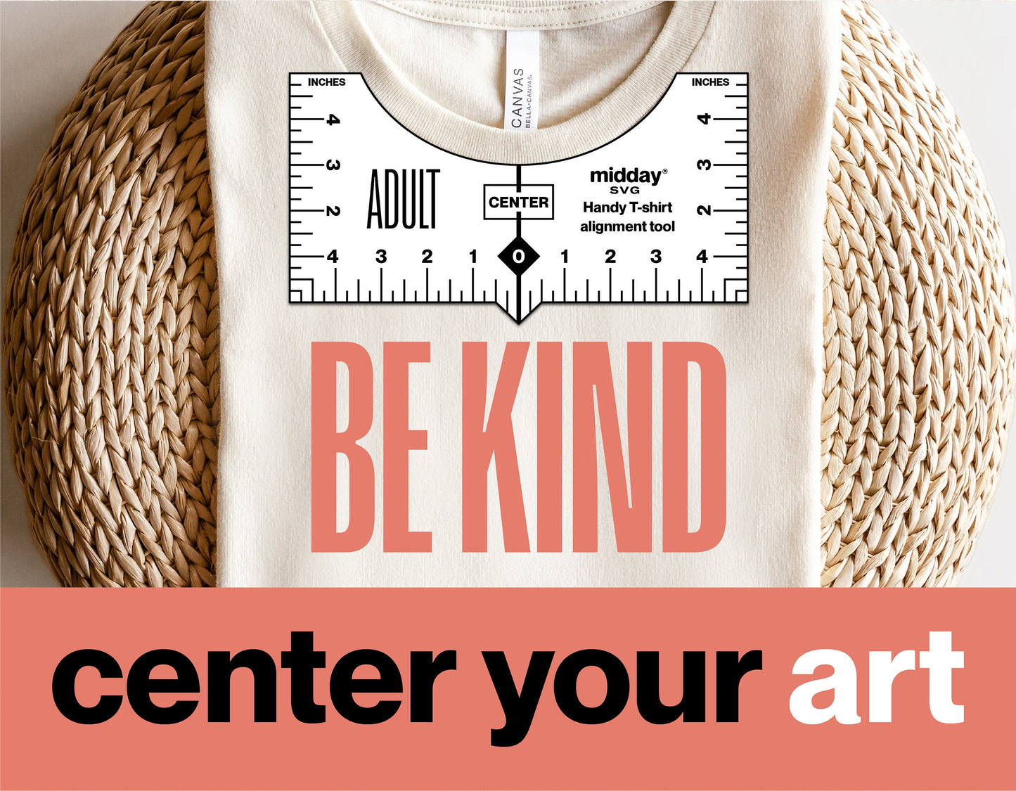 T-shirt with 'Be Kind' design using alignment tool printable, displayed on wicker background with 'center your art' text.