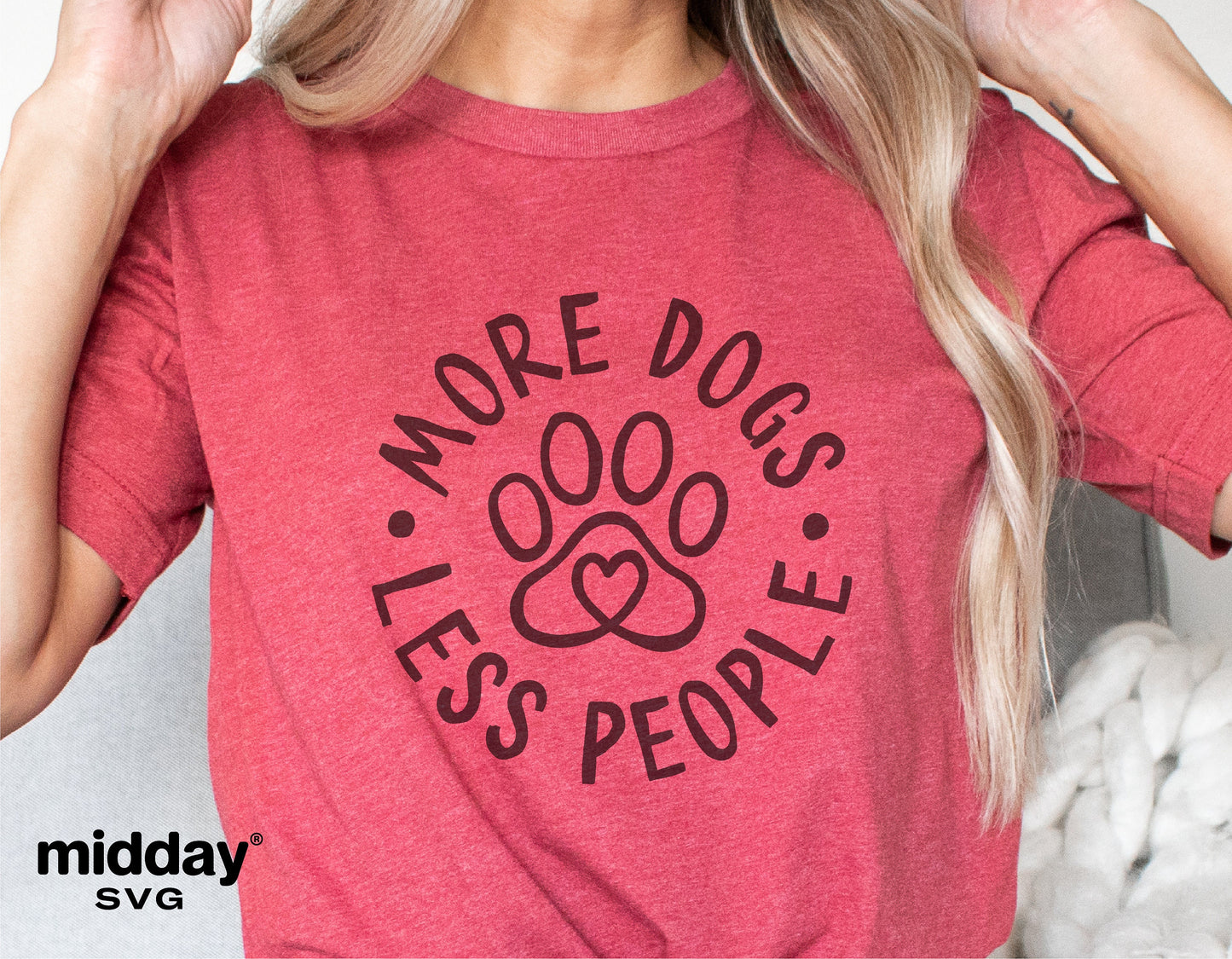 Red shirt with 'More Dogs Less People' design featuring paw print, ideal for dog lovers; digital cut file for Cricut, Silhouette.