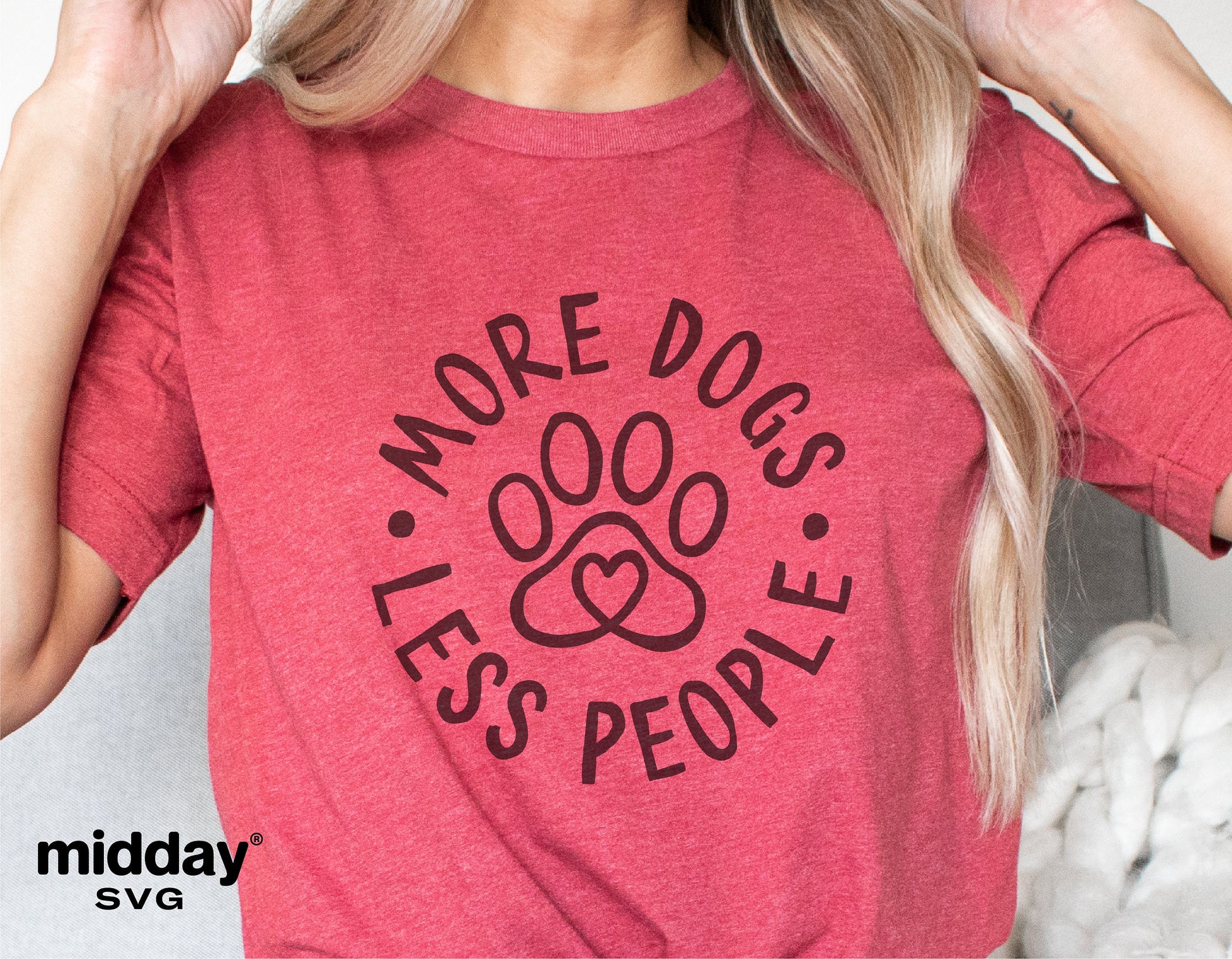 Red shirt with 'More Dogs Less People' design featuring paw print, ideal for dog lovers; digital cut file for Cricut, Silhouette.