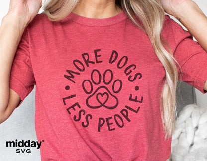 Red shirt with 'More Dogs Less People' design featuring paw print, ideal for dog lovers; digital cut file for Cricut, Silhouette.