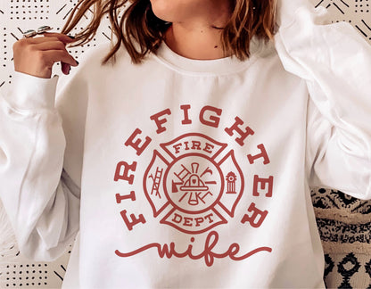 White sweatshirt with 'Firefighter Wife' and firefighter badge design, perfect for Cricut and Silhouette crafting, available in digital downloads.