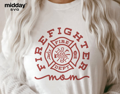 Woman wearing a Firefighter Mom shirt featuring a firefighter badge design in red, suitable for Cricut and Silhouette cut files.