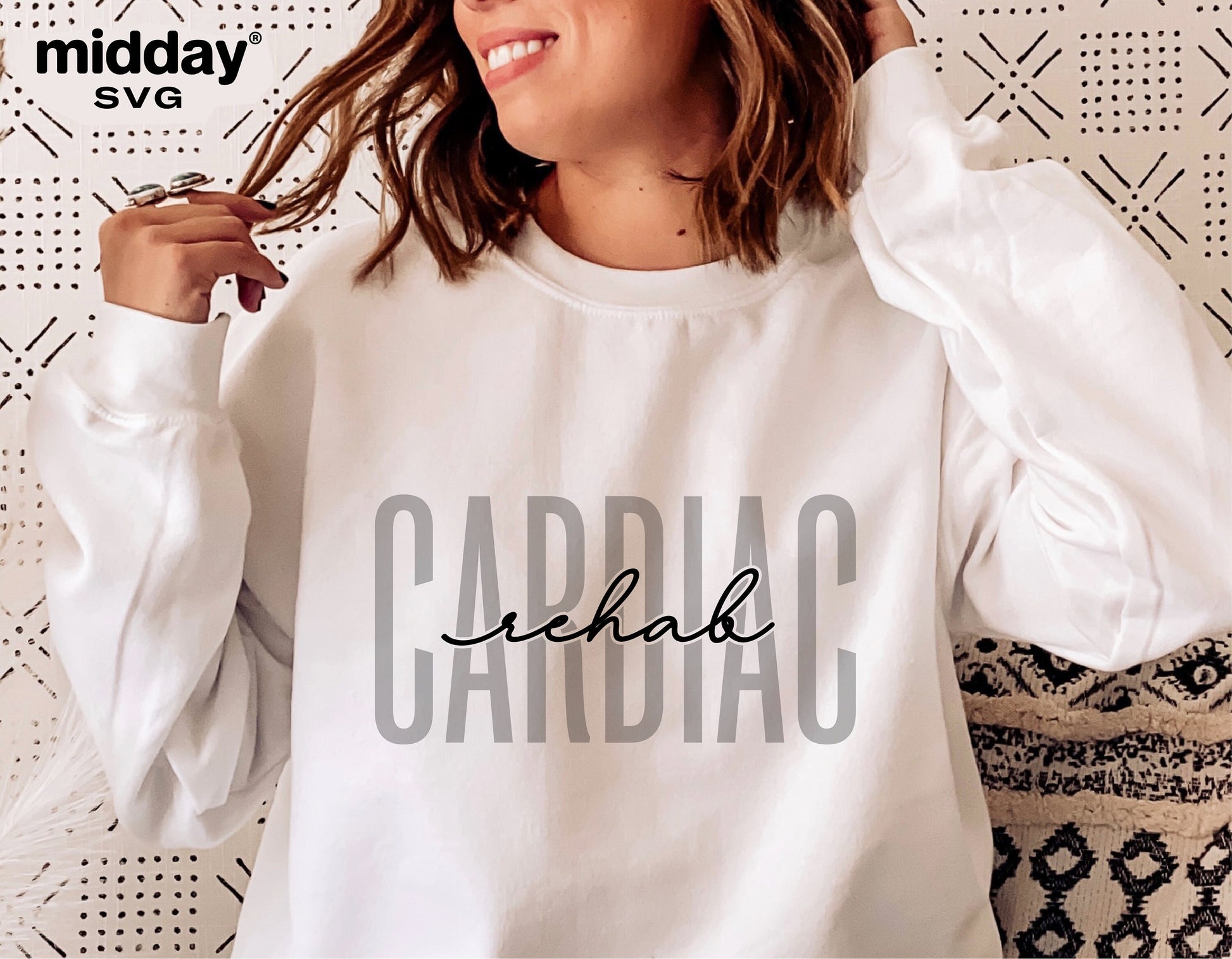 Woman wearing a white sweatshirt with 'Cardiac Rehab' design in stylish typography by Midday SVG.